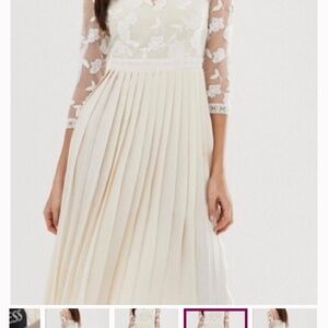 Sheer sleeve cream pleated dress NWT Size 22